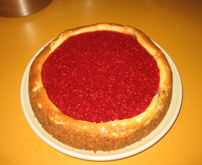 Chocolate swirl cheesecake with raspberry glaze and waffle cone crust (yum!)