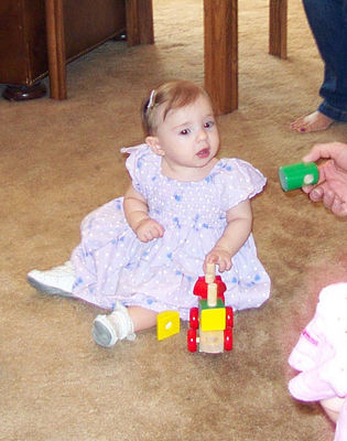 Maddy playing with blocks