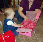 Opening a present from Aunt Megan, Uncle Frank & Maddy