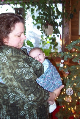 Grandma Joan lulling Annabel to sleep in the sling
