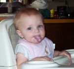 Annabel licking yogurt off of her chin!