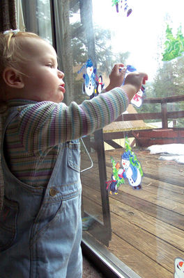 Playing with snowman window clings (#1)