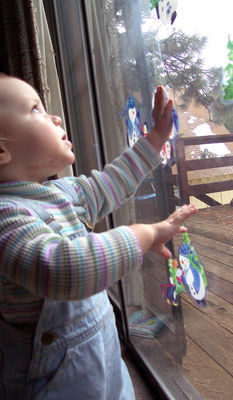 Playing with snowman window clings (#2)