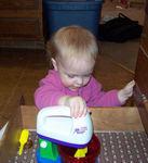 Annabel playing with her new mini-mixer set (#3)