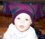 Annabel modeling a new hat that Mommy made
