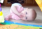 Annabel managed to scoot herself off of the playmat again! :)