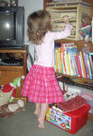 Getting a puzzle (wearing her new valentine's skirt)