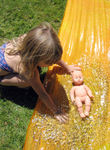 Giving baby a bath in the slip-n-slide