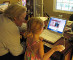 Showing Gramlee how to use the computer