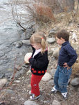 Throwing rocks into the river