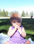 Chewing on a spoon at the park (Father's Day 2004)