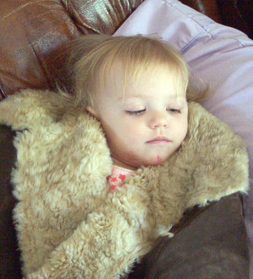 Snuggled up in Momma's winter coat