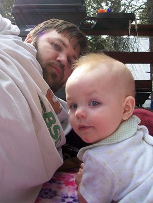 Annabel playing outside on the deck with Daddy