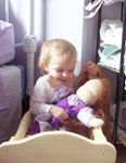 Annabel rocking her baby in the cradle ;)