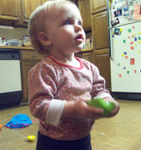 Playing with wooden fruit