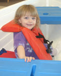 Playing in the boat at KidZone (#2)