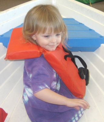Playing in the boat at KidZone (#1)