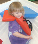 Playing in the boat at KidZone (#1)