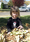 Playing in the leaves on Halloween morning (#1)