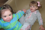 Leann & Annabel holding hands down the slide