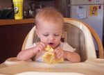 Annabel inspecting her first pancake