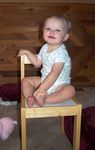 Annabel sitting in her big girl chair!