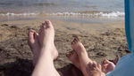 Sandy feet on the beach