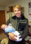 Our friend Heather holding Annabel at her office