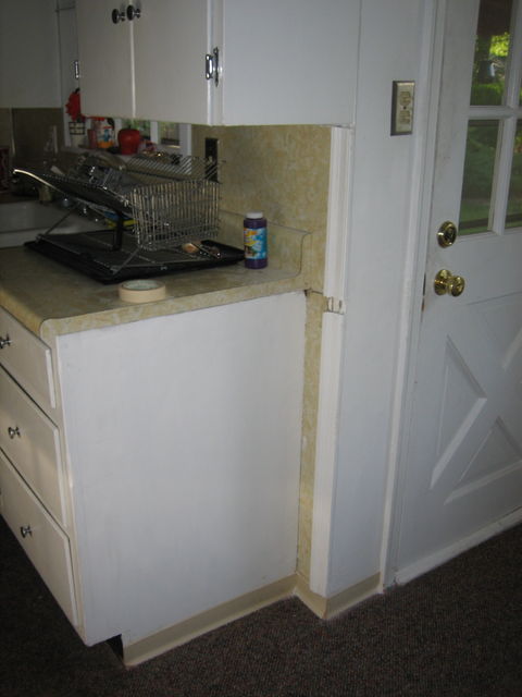 spackled & painted cabinet (took that nasty shelf down... now to replace the trim on the edge of the wall!)