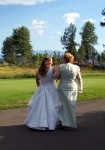 Jula and her mom walking to the reception area after the ceremony
