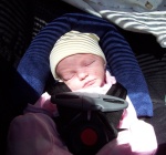 Annabel in her carseat for a trip into town